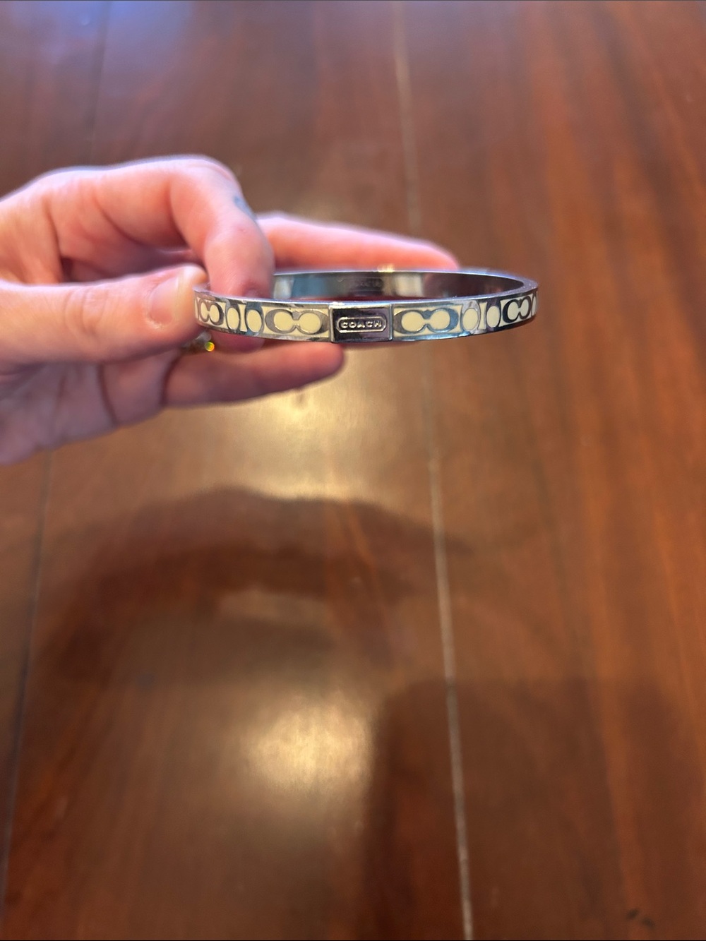 Coach Silver Tone Bangle with White Signature Pattern